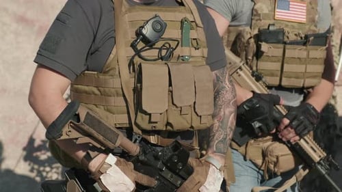 Armed Men in Tactical Gear Holding Rifles