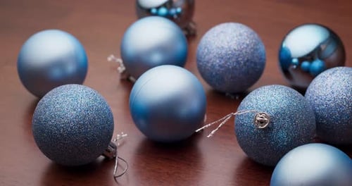 Blue Christmas Ornaments on Wood Surface