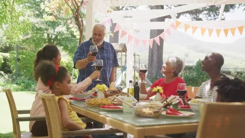 Multi-generation African American family spending time in garden