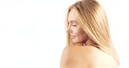 Smiling Blonde Woman Posing Against White Background