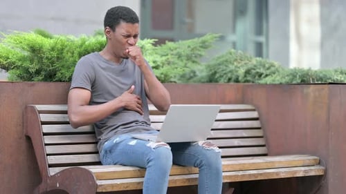 Man Works on Laptop then Coughs on Bench