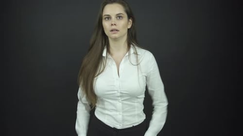 Actress Turns Around Fastens Blouse Button with Confusion