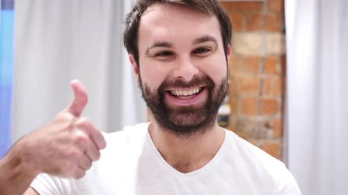 Smiling Man Gives Thumbs Up Approval Close Up