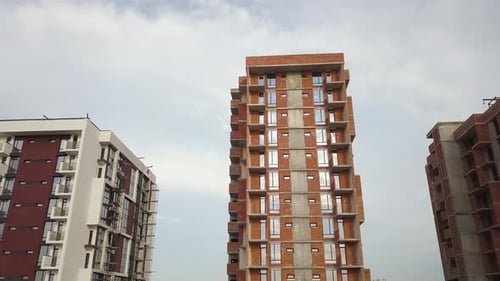 Aerial view of tall residential apartment buildings under construction. Real estate development