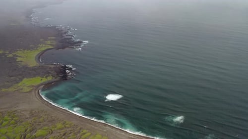 Volcanic Island, Waves Crashing on Black Sand Beach