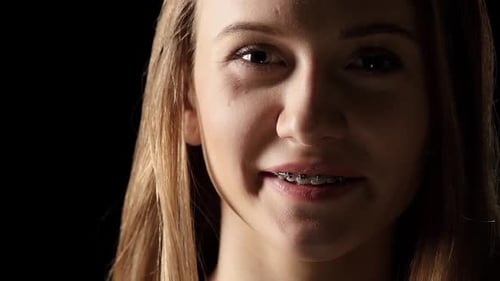 Young Woman's Portrait Smiling After a Tear