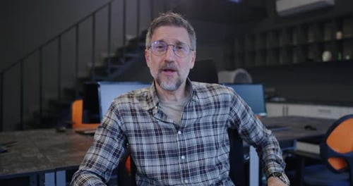 Man Talking To Camera in an Office