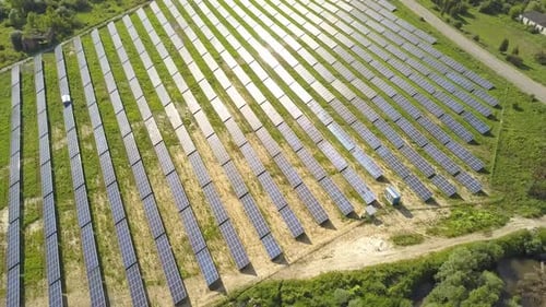 Aerial view of solar power plant field. Electrical photovoltaic panels for producing clean ecologic