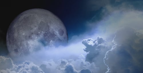 Full Moon and Swirling Clouds in a Mysterious Night Sky