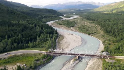 4K aerial drone footage of a bridge over Toad´s river where few vehicles are crossing. Incredible na