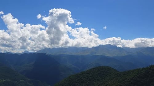 Time-lapse scene in mountains with clouds in national park Dombay, Caucasus, Russia