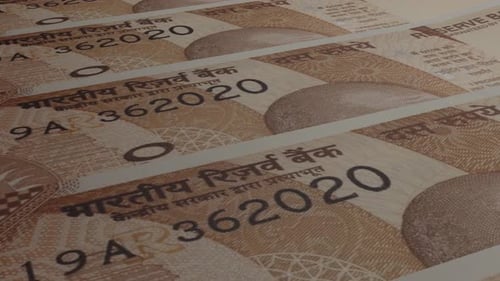 Indian Rupee bills background.