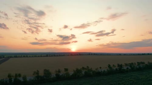 Aerial View. Beautiful Nature, View on Rural Countryside Landscape and Fields, Shining Sun Sunset
