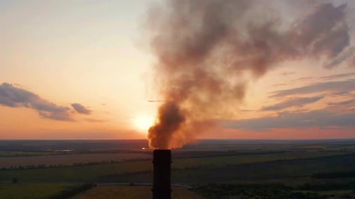 Aerial View. Industrial Pipe Pollute the Air Next To People Living in the City