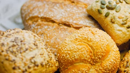 Freshly Baked Bread Rolls and Loaf Close-Up
