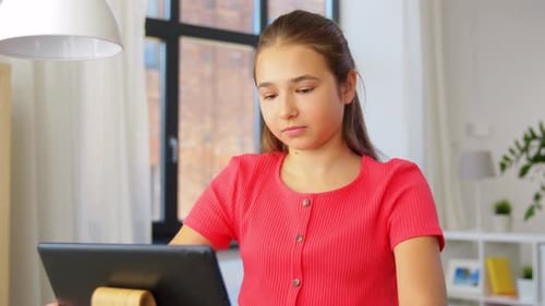 Teen Girl Using a Tablet at Home