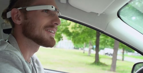Man Driving Car Wearing Advanced White Glasses