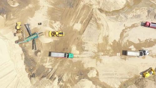 Aerial view loading bulldozer in open air quarry. Sand mining industry. Bulldozer machine. Crawler b