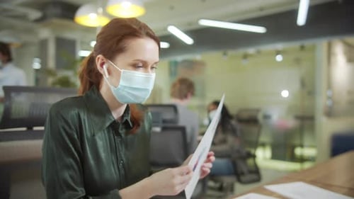 Businesswoman Presenting Graphs During Remote Meeting