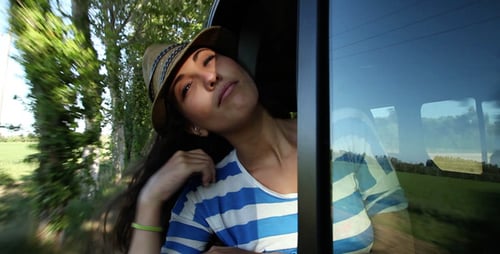 Woman Enjoying Road Trip Through Rural Countryside