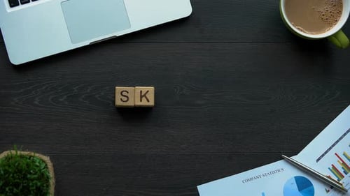 Office Desk Displaying Skills with Wooden Letter Blocks