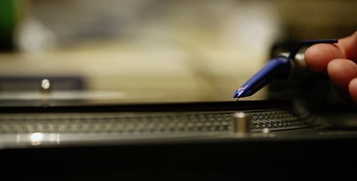 Record Player Needle on Vinyl Record Closeup
