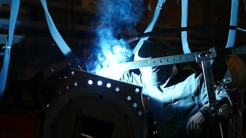 Worker Welding Metal Structure