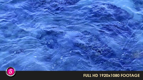 Gentle Ocean Waves Washing over Rocks