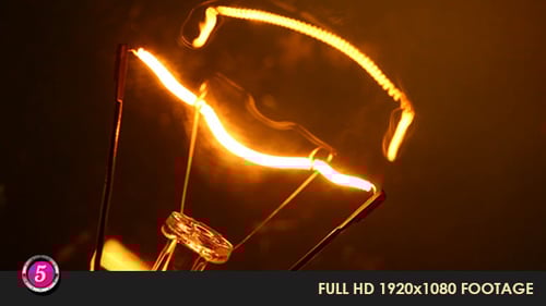 Illuminated Filament of Glowing Lightbulb Close-up