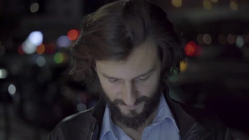 Cheerful Handsome Man Smiling at Camera in Evening City