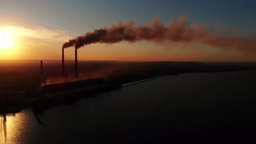 Aerial Drone View: High Chimney Pipes with dirt smoke from Coal Power Plant.