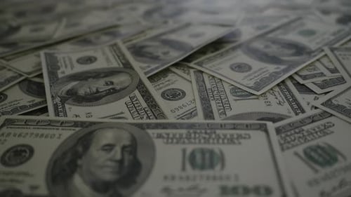 Slow motion of Counting dollar banknote money on table