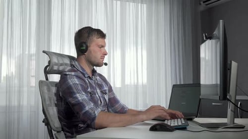 Young Adult Working From Home at Computer
