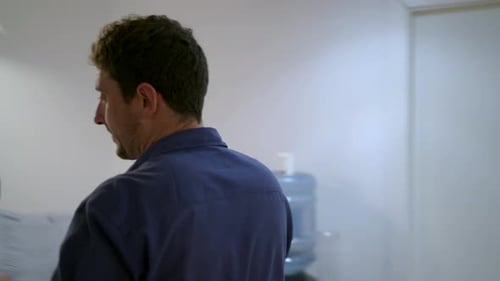 Man scanning paper document in office