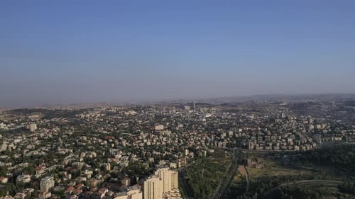 Aerial far long shot of Jerusalem city urban area from the sky, clear day