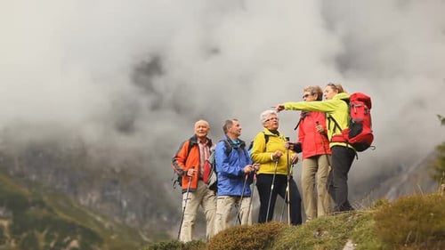 Group Hiking With Poles in Mountainous Terrain