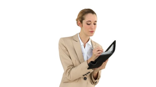 Woman Writes in Planner on White Background