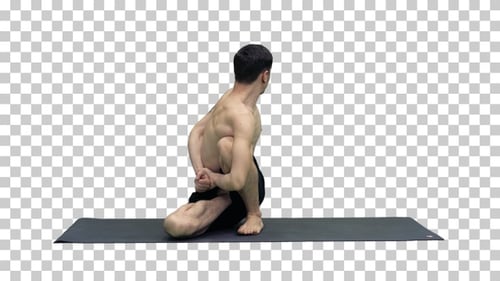 Mann übt Yoga Sage Twist C Pose oder Marichyasana Pose Stretching