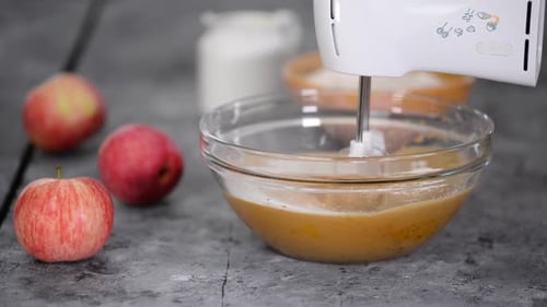 Apple Batter Being Mixed With Electric Mixer