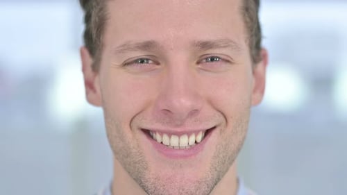 Close Up of Face of Young Male Smiling at the Camera