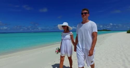 Fun people married on vacation enjoy life on beach on sunny white sandy background