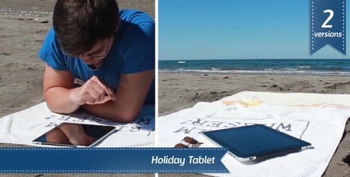 Man Uses Tablet Relaxing on a Beach