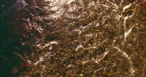 Low Altitude Flight Over Fresh Fast Mountain River with Rocks at Sunny Summer Morning.
