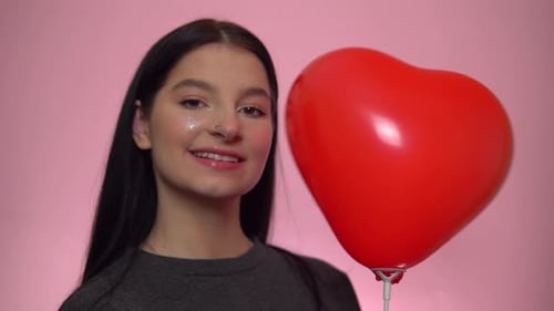 Girl Posing with Heart Shaped Balloon