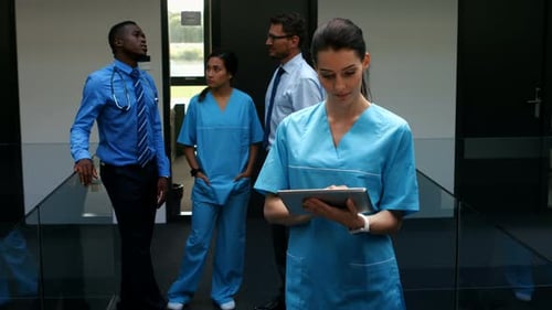 Female doctor using digital tablet in hospital