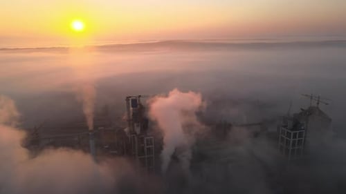 Aerial View of Cement Factory with High Concrete Plant Structure and Tower Crane at Industrial
