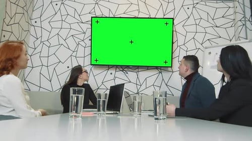 Business Meeting Around Table with Chroma Key Screen