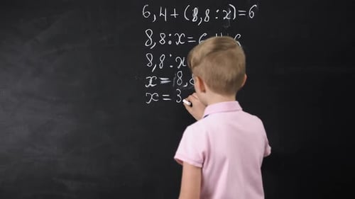 Boy Writing on Chalkboard Math Equation, Solving Exercise, Education Reform