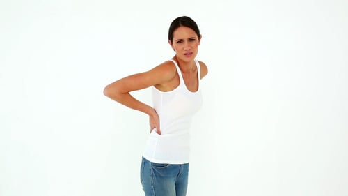 Slim Model In Jeans With A Back Ache