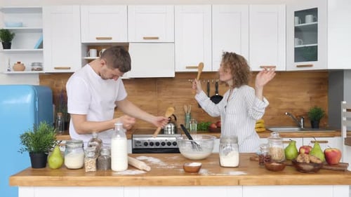 Couple Dancing Together in the Kitchen